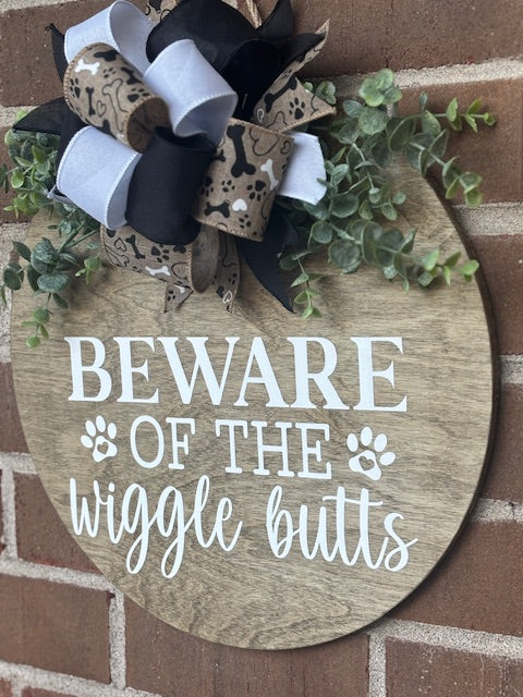 Beware of the Wiggle Butts Door Hanger